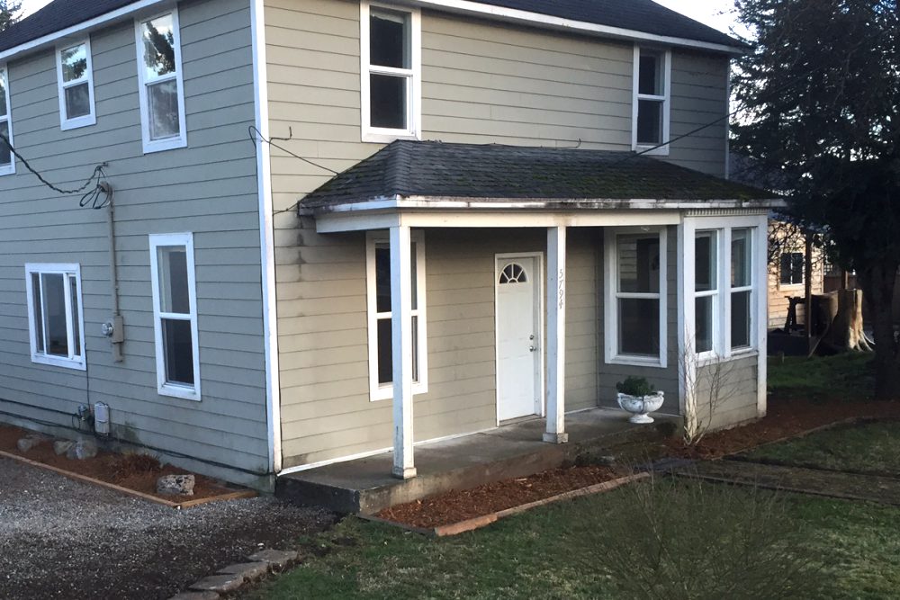 Two-story gray rental home with a covered front porch in Whatcom County