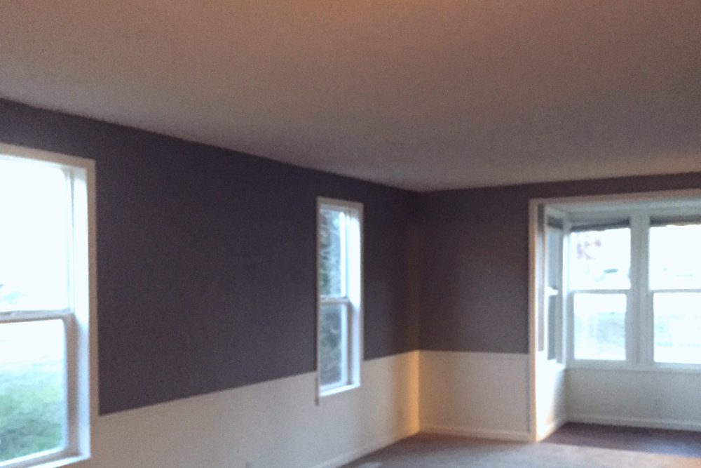 Living room with a bay-window nook in a Lorimer Properties rental